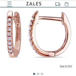 10 karat rose gold huggie hoop earrings with 1/10 karat tw diamonds.